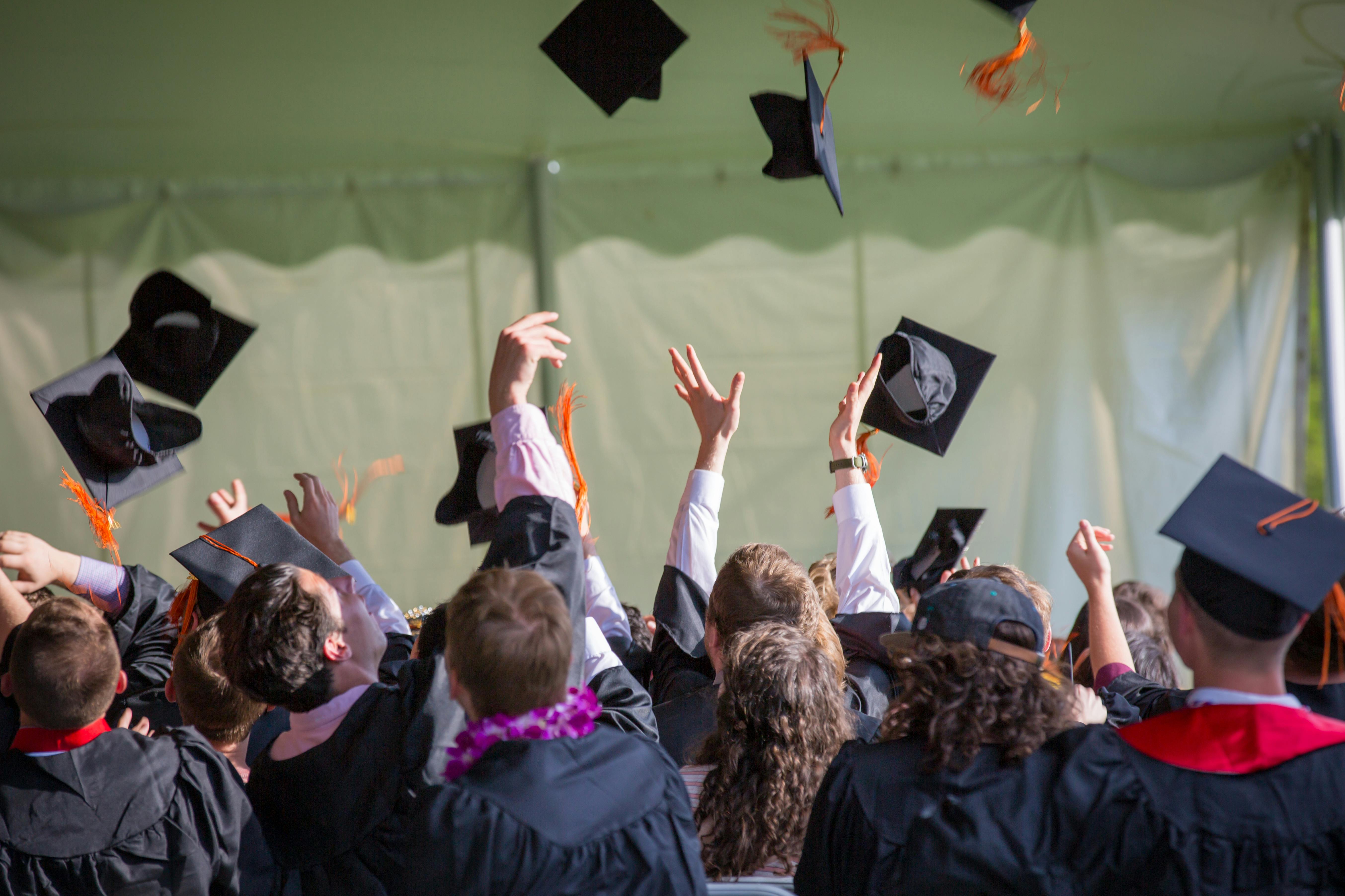 College graduates celebrating achievement and looking toward future careers